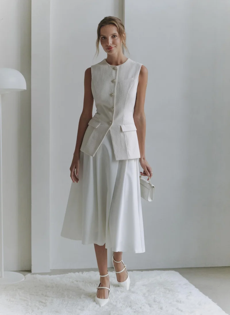 ليتشي صدرية مزودة بأزرار مميزة